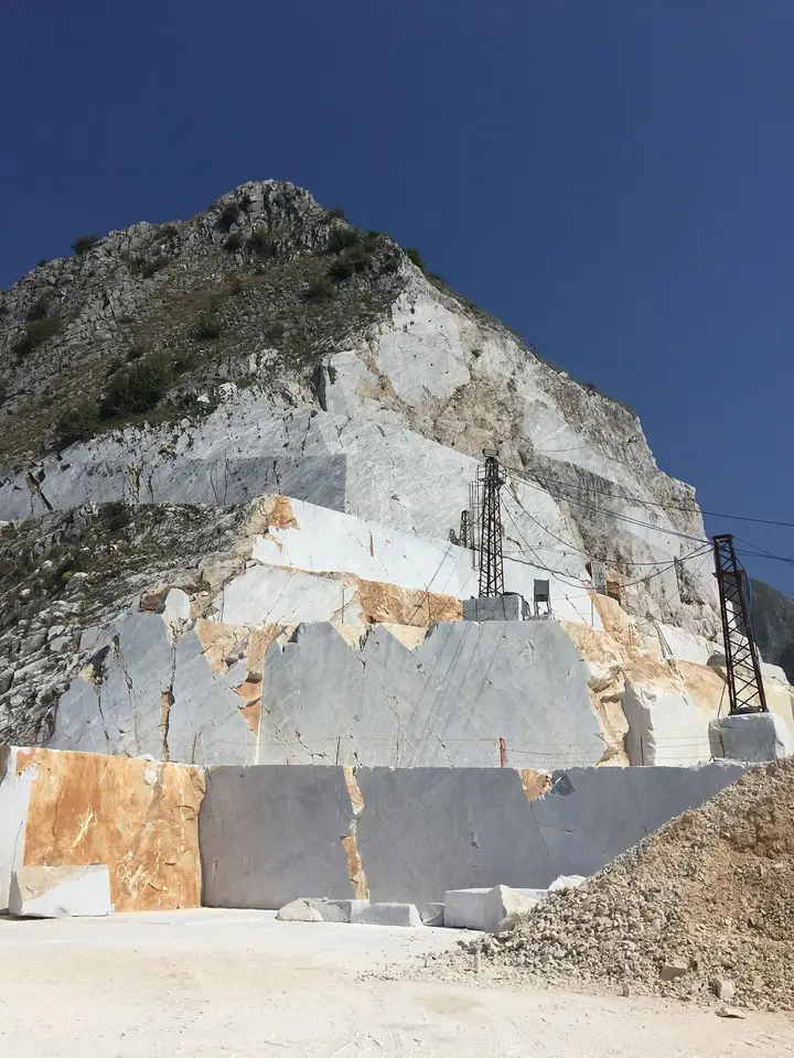 A cut face of white marble at a quarry in Carrara, Italy